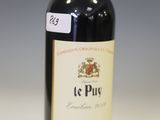 a bottle of wine that is sitting on a table