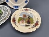 many plates with different designs on them on a table