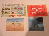 three postcards of various animals and animals on a table
