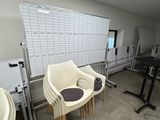 a room with a lot of chairs and tables in it