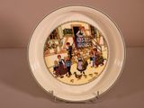 a plate that has a picture of a family on it