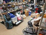 a room filled with lots of clutter and tools