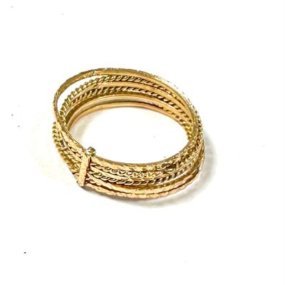 gold plated bracelets on a white surface with a white background