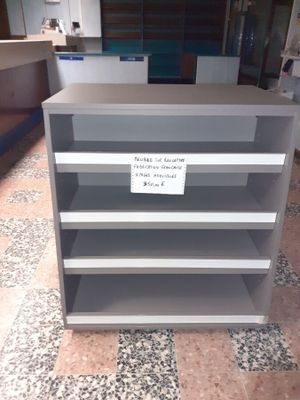 a shelf that has a sign on it in a store