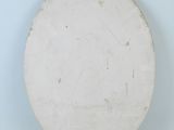 a white plate that is sitting on a white surface