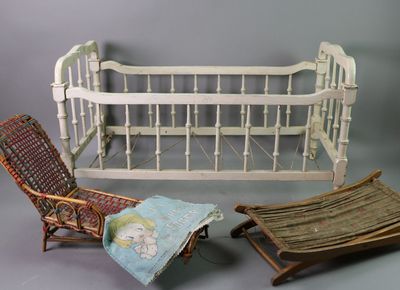 a baby crib and a rocking chair next to each other