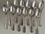 a lot of spoons that are on a table