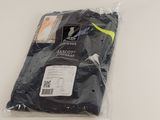 the shirt is in a plastic bag on a white surface