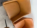 three chairs that are next to each other on a tiled floor