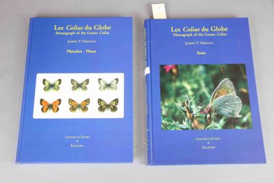 pair of two books with butterflies on them sitting on a table