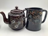 two teapots sitting next to each other on a table
