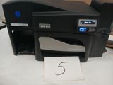 a printer that is sitting on a table with a number on it