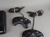 two game controllers and a charger on a table