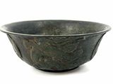 a bowl that is sitting on a white surface