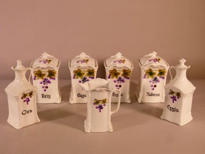 five small white vases with purple flowers on them