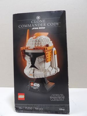 a box of lego star wars clone commander cody ' s helmet