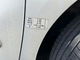 a sticker on the side of a white car