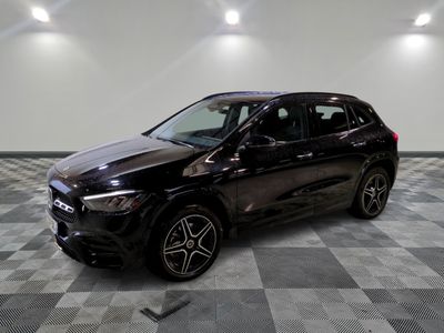 the mercedes suv is parked in a clean room with checkered flooring