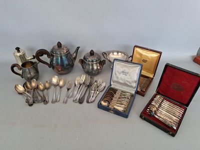 many silverware items sitting on a table next to each other