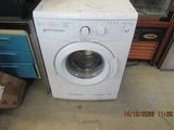 a washing machine that is sitting on the floor