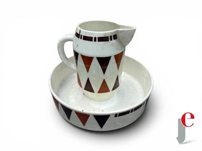 a picture of a pitcher and a saucer on a plate