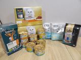 many different types of cat food on the table