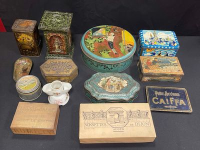 many different types of tins and boxes on the table