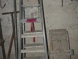 a ladder that is leaning against a wall in a room