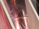a picture of a close up of a glass with a liquid inside of it