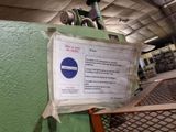 a sign posted on the wall of a machine shop
