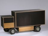 a black and wood truck with two drawers on wheels