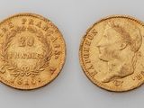 two gold sovereigns, one of which has a bust and the other of which is a bust