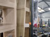 many shelves that are in a room with a lot of shelves