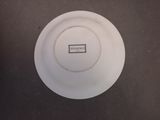 a white plate with a black and white label on it