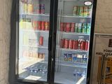 a refrigerated refrigerator in the corner of a building