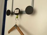 a picture of a mirror with a coat hanger on it