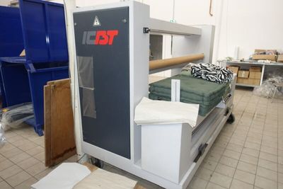 an image of a bed in a room with a machine
