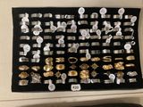 a display of various rings and bracelets on the wall