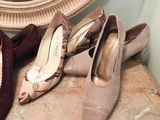 several pairs of women ' s shoes are lined up on a table