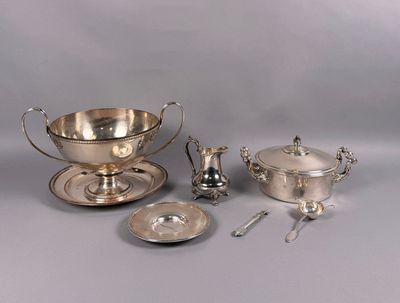 several pieces of silverware including a bowl, saucer, and spoon