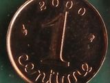 a close up of a coin with the number one on it