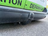 a green and black sign on the side of a van