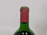a bottle of wine that is sitting on a table