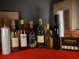 many bottles of wine and bottles of wine on a table