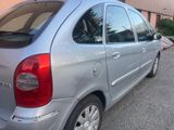 a silver car that is parked in a parking lot
