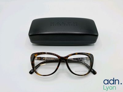 the glasses are next to the case on the table
