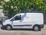a white van that is parked on the side of the street