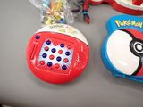 two pokemon toys on the table next to each other