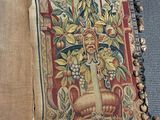 a very large tapestry with a picture of a vase on it