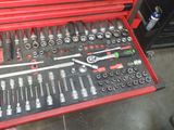 a red tool box with many tools in it